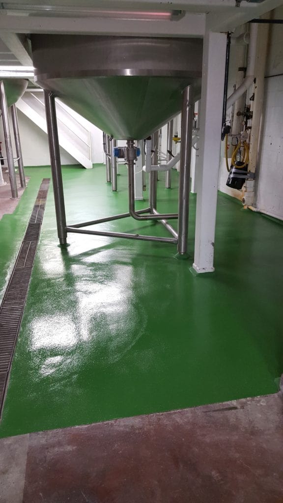 Green urethane concrete flooring installed in a food processing facility