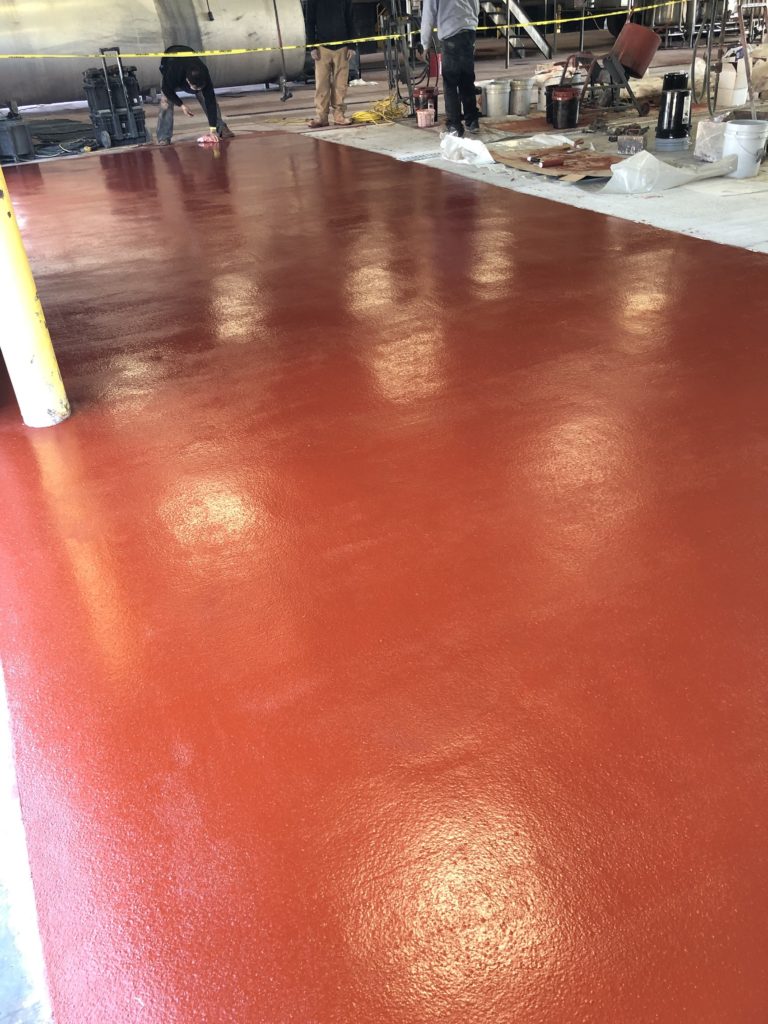 Red Flow Resin flooring installed in an Iowa truck tank wash facility